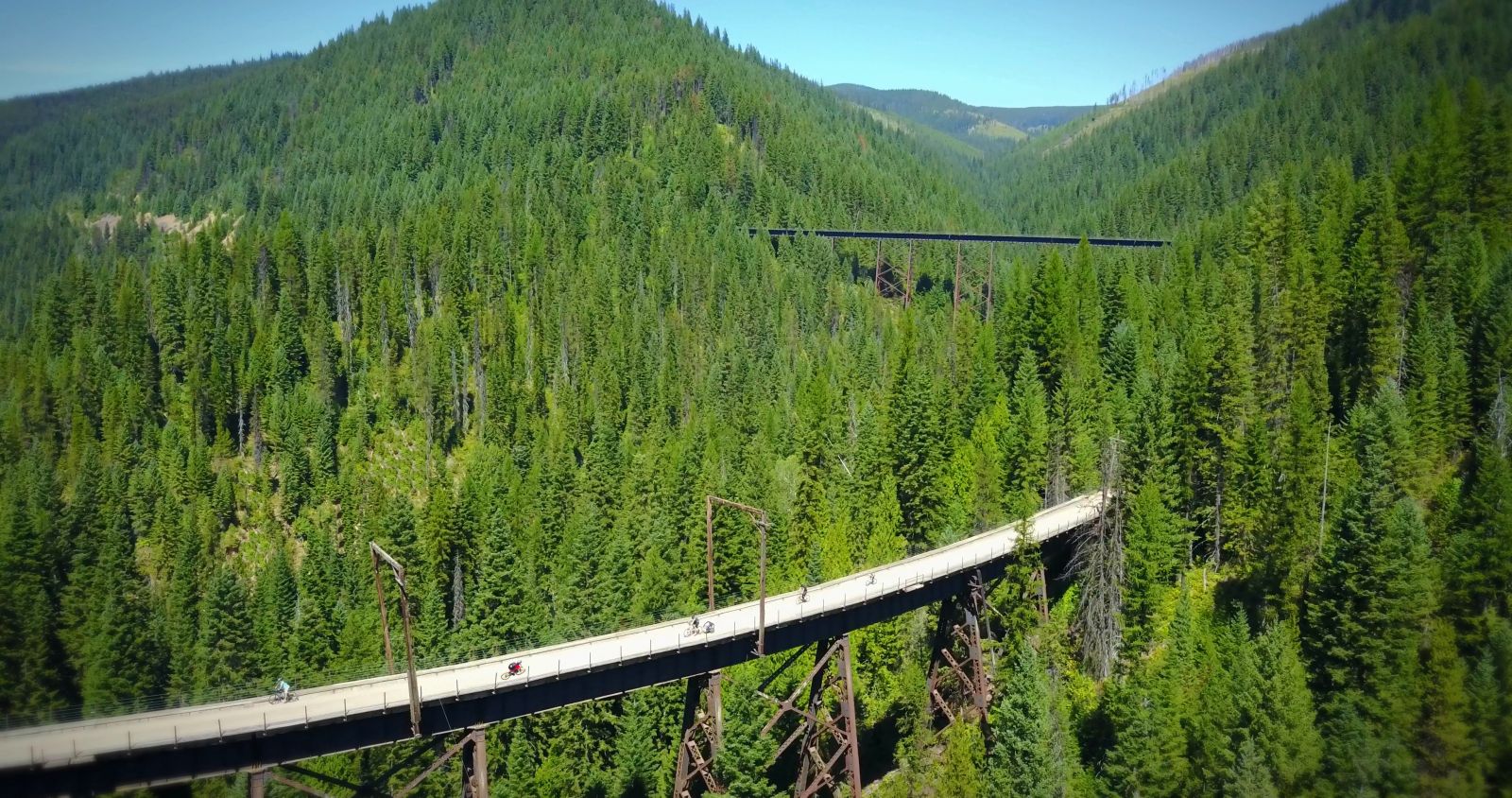 If you look close you will see the signature Red Jersey of a bike Patroller riding across the first trestle in this picture below.